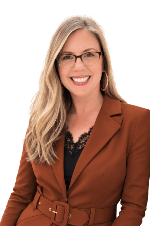 Amber Cummer Amber Cummer, Principal at Agent Contract Services, smiling in a rust colored blazer